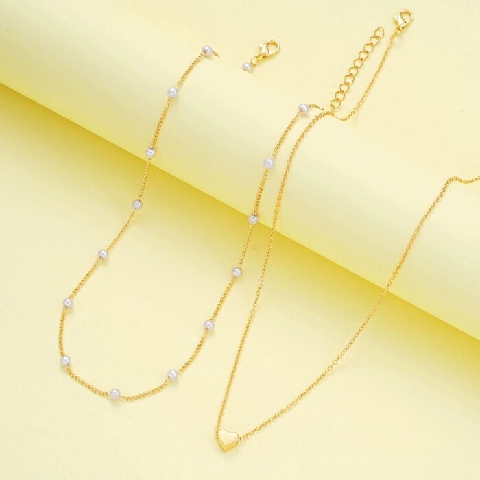 Modernt Smyckesset med Hjärta och Imitationspärlor – Halsband och Armband i Guld- eller Silverfärg för Dam - Bild 3