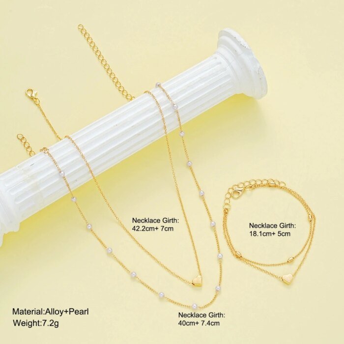 Modernt Smyckesset med Hjärta och Imitationspärlor – Halsband och Armband i Guld- eller Silverfärg för Dam - Bild 2