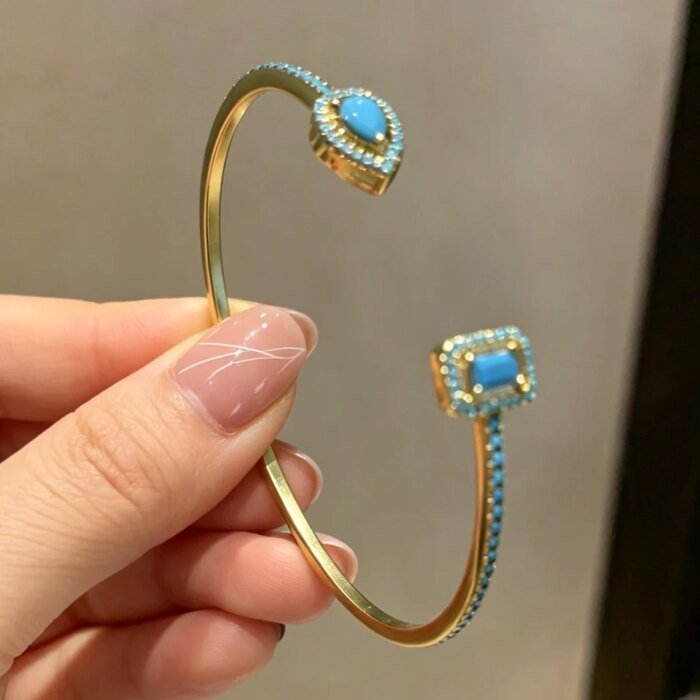 Lyxigt Geometriskt Guldtonat Armring för Kvinnor, Cubic Zirconia Armband i Modern Design för Fest och Vardag - Bild 5