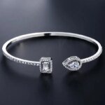 Lyxigt Geometriskt Guldtonat Armring för Kvinnor, Cubic Zirconia Armband i Modern Design för Fest och Vardag - Bild 2