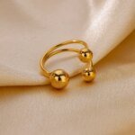 Dubbelt ring-set i rostfritt stål med pärldetaljer – Guldbelagd, geometrisk och justerbar design - Bild 3