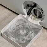 Droppskål för tvättmaskin med luddfilter och avloppsskydd
