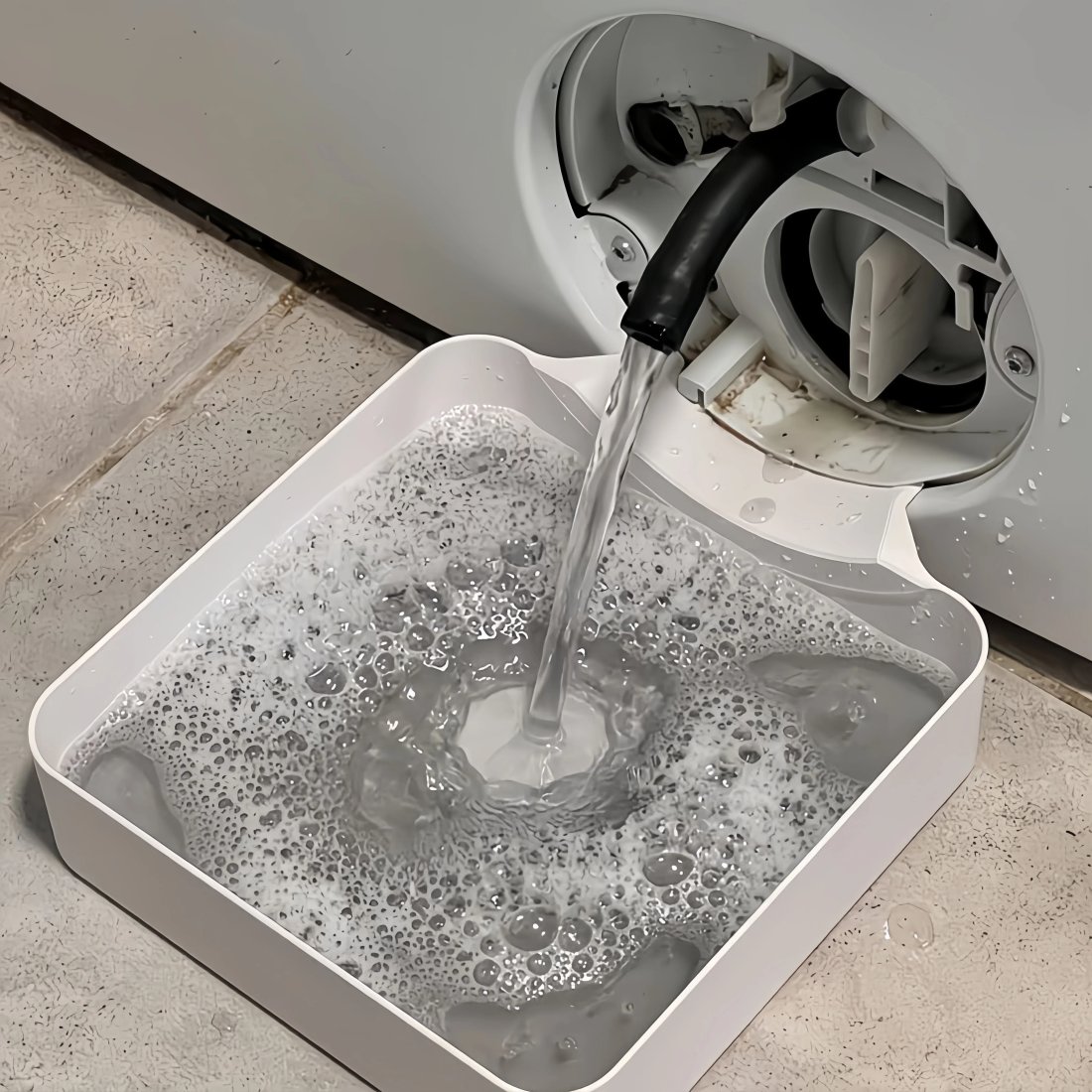 Droppskål för tvättmaskin med luddfilter och avloppsskydd Droppskål för tvättmaskin med luddfilter och avloppsskydd