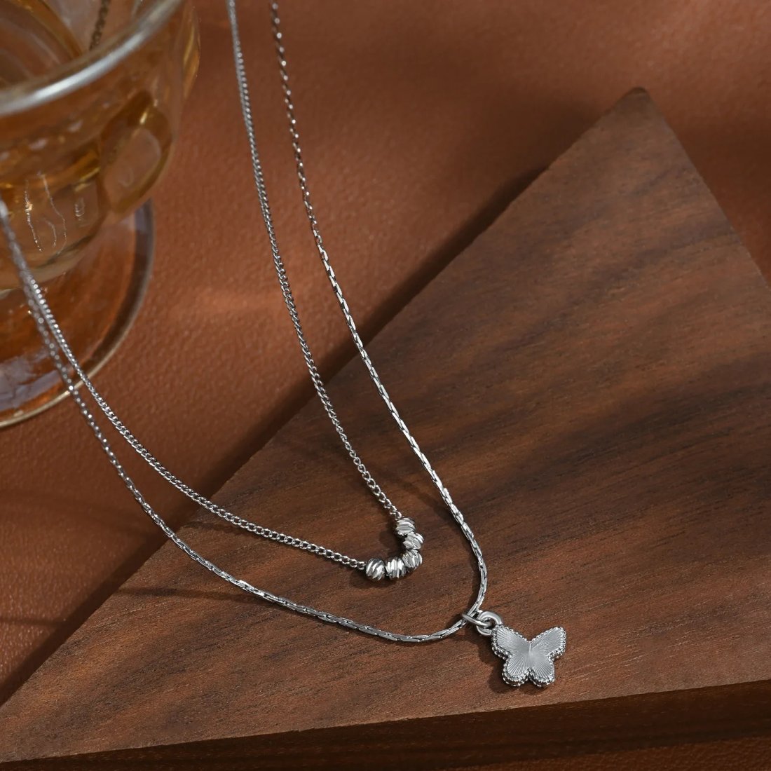 Exklusivt dubbelkedjigt fjärilshalsband i 925 sterling silver
